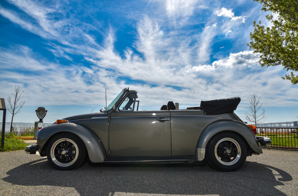 1979 Volkswagen Super Beetle convertible parked by the waterfront