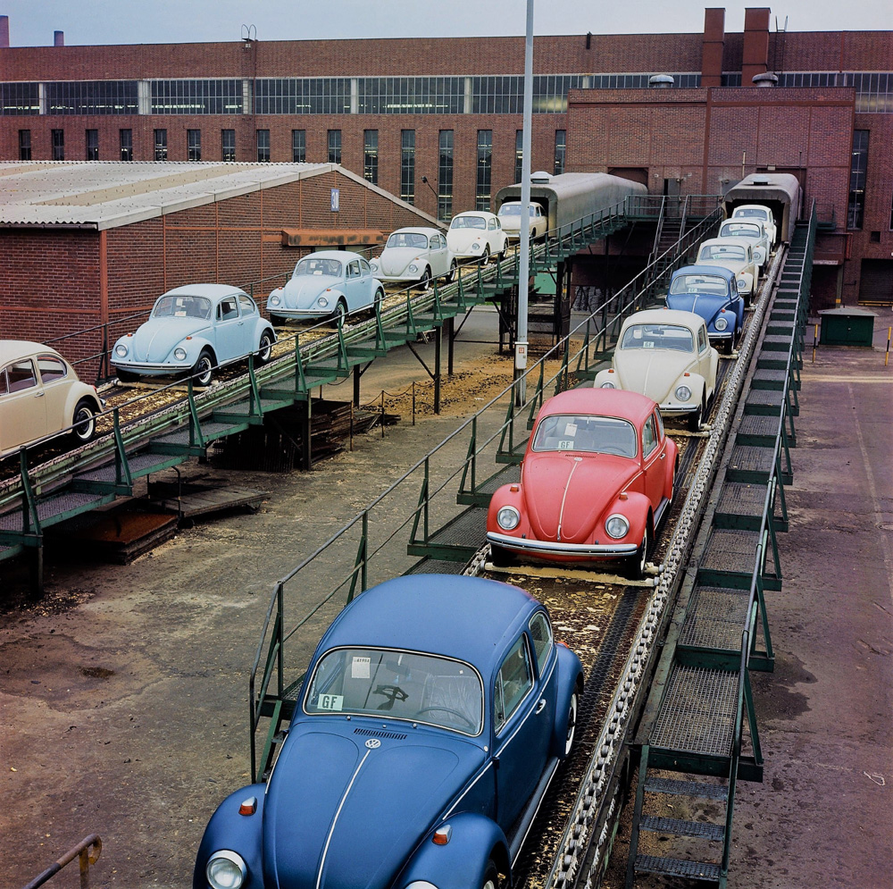 This very colourful scene shows 1968 Model Year Volkswagens emerging from final assembly Hall 12