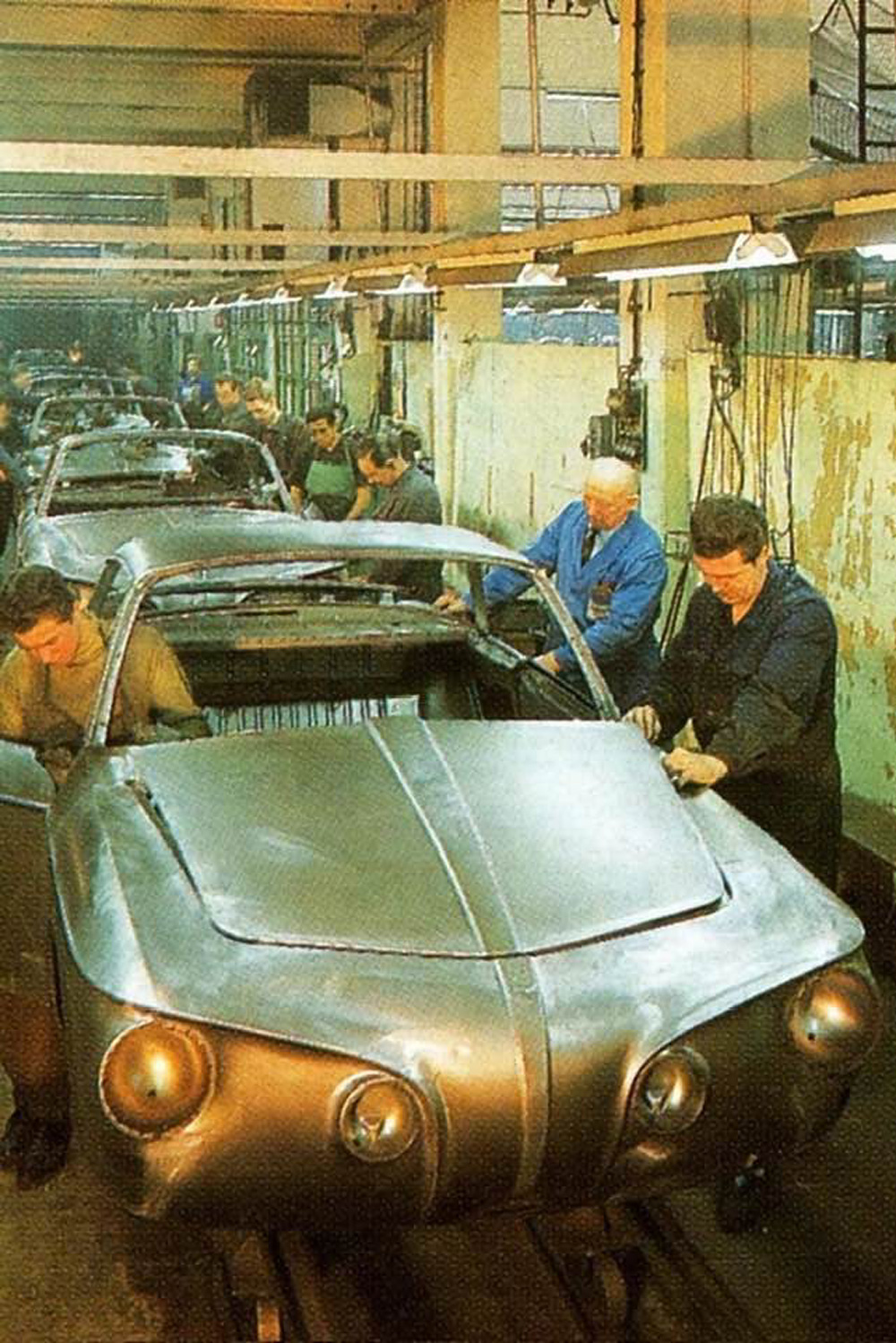 Workers at the Karmann plant are busy with a Type 34 Karmann Ghia