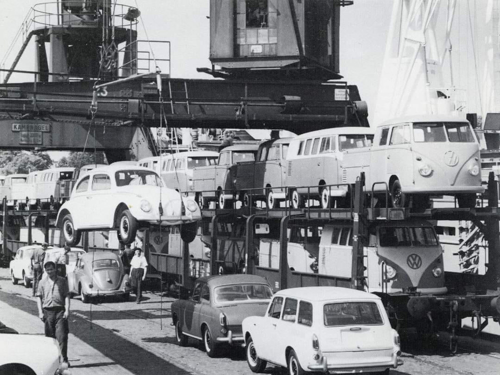 From train to ship. Early 60s Volkswagens going out to roam the earth