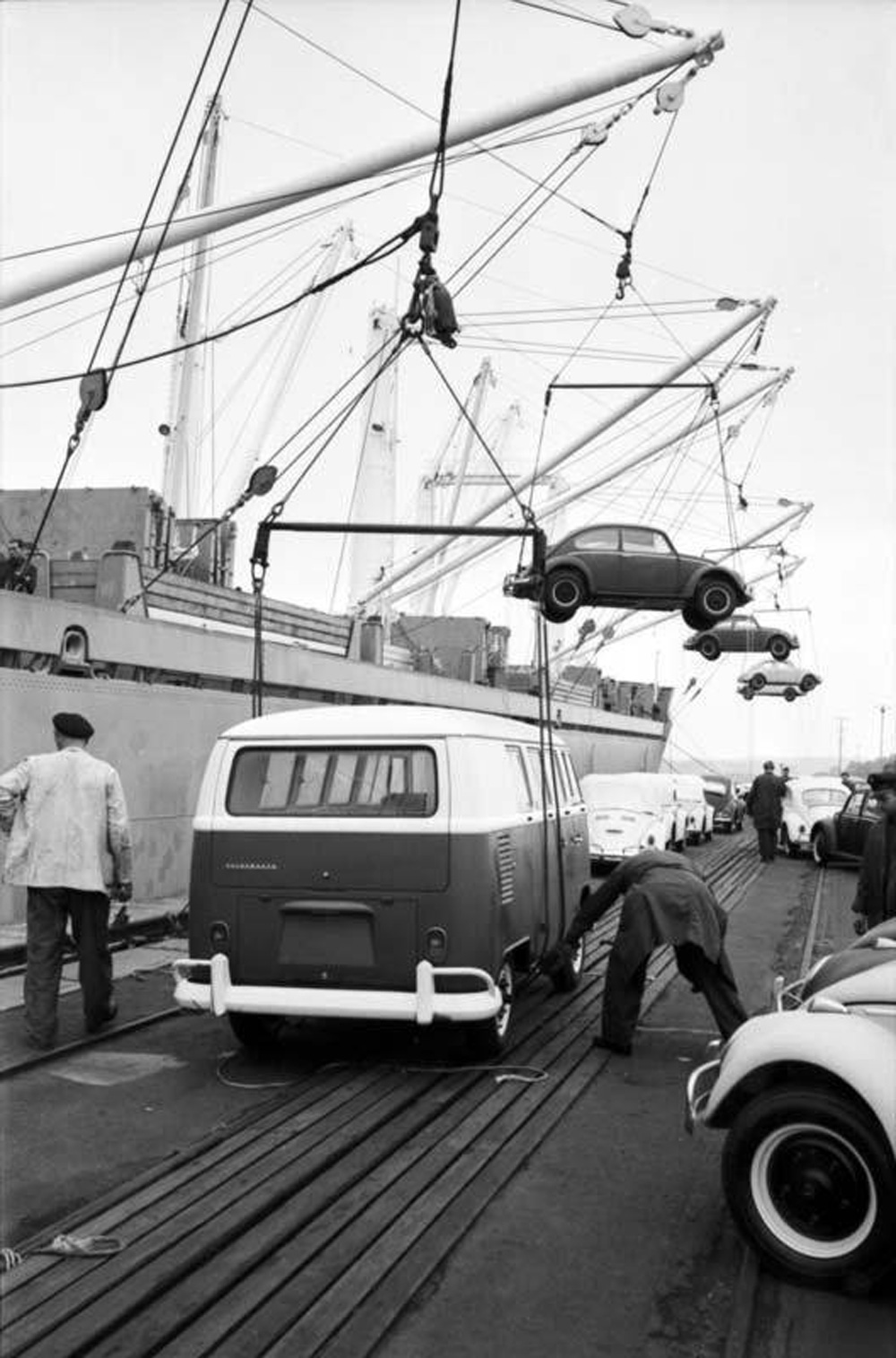 Beetle sedans and cabriolets, plus a Type 2 Bus, are loaded aboard cargo ship MS Ferder on the Burchardkai