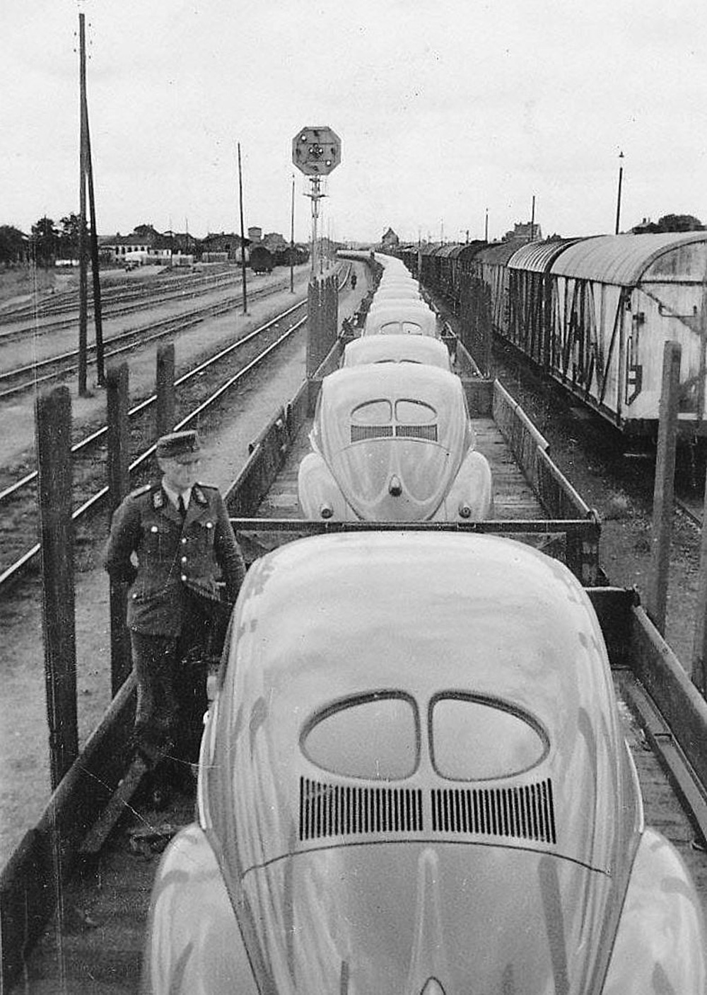 Dozens of new Volkswagens stand on a train from the Wolfsburg factory in the very early 1950s