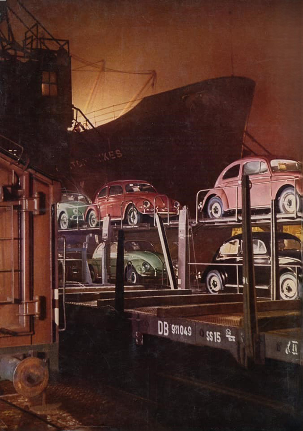 An atmospheric night photo of new Volkswagens arrived by train at a German port for export to the USA in 1960